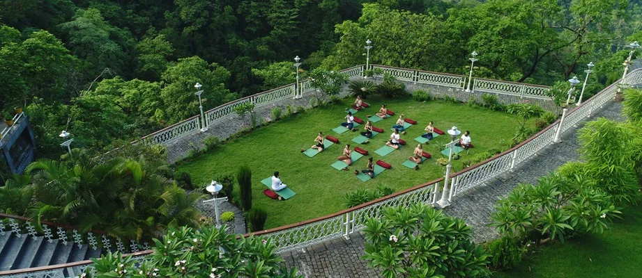 Aerial View of Yoga Classes in rishikesh at Abhayaranya Yoga Ashram Abhayaranya Yoga Ashram nestled in the lush greenery of Rishikesh, offering Yoga Teacher Training and Retreats in Rishikesh