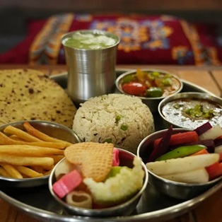 Spacious and serene private room at Abhayaranya Yoga Ashram in Rishikesh, offering a peaceful retreat surrounded by nature - ideal for yoga practitioners and spiritual seekers.