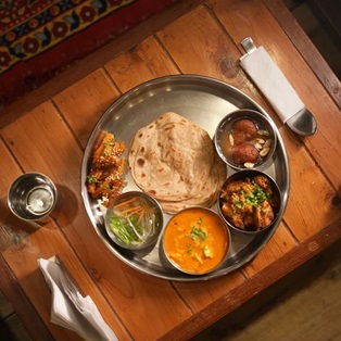 Saatvic Meal at Abhayaranya Yoga Ashram in Rishikesh, designed for peaceful living with serene surroundings and essential amenities for yoga practitioners.